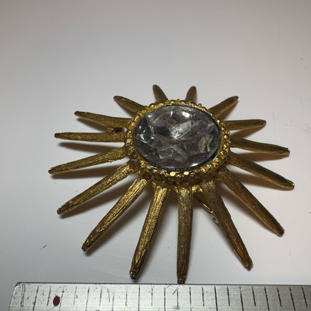 Vintage Large Gold Tone Sunburst Brooch with Clear/Gray Gem Center